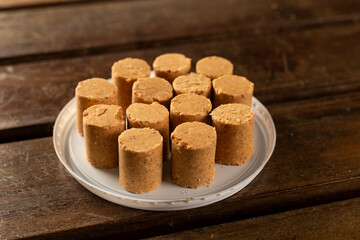 Sweet Brazilian Peanut Called Paçoca on a wooden desk