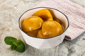 Canned marinated peach in syrop