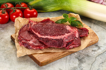 Raw beef cheeks cut for cooking