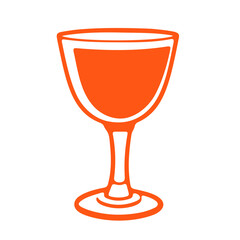 An orange wine glass on a wooden table during daytime with a bouquet of flowers in the background