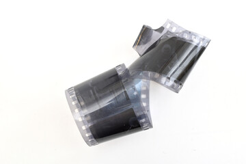 An old developed photographic film lies on a white background.