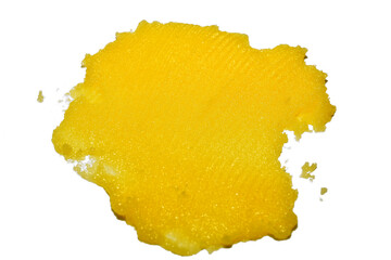 Yellow stain of melted butter on white background.