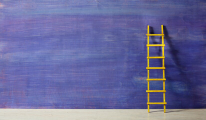 Creativity,solution,innovation,idea,thinking out of the box concept, blue painted wall with ladder...