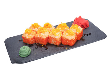 Sushi roll with salmon, eel, caviar and cream cheese on black slate plate. Isolated over white...