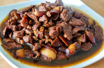 Top view of pork cooked in soy sauce with customizable space for text. Asian food concept