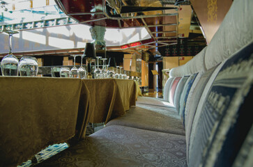 Kitschy colorful loud interior design decor inside a la carte speciality restaurant onboard modern...