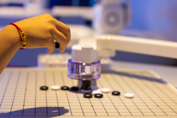 a person is playing a game of chess with the number 9 on it.