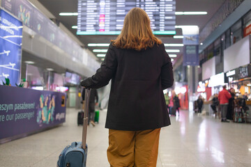 Portrait of Caucasian traveler woman hold ticket ready enjoy voyage tour passenger walk in airport...