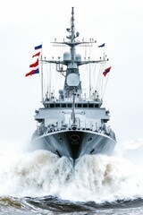 Warship cutting through stormy seas.