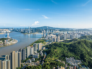 Fototapeta premium Modern city buildings with skyline and natural scenery in Macau