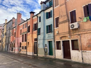 View along street in Chioggia, Italy with colorful houses