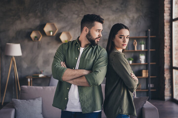 Photo of stressed depressed woman man dressed casual shirts arms crossed indoors house apartment...
