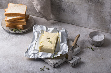 Fresh butter on grey backgrouns.
