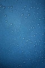Blue water droplets texture background overhead view