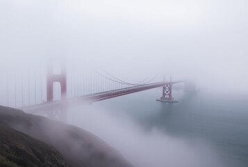 Golden Gate Bridge Fog rolling in obscuring parts of the bridge