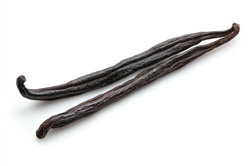 Two dark, dried vanilla beans with wrinkled texture and curved shapes against a white background, showcasing their aromatic and culinary value.
