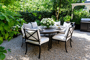 weathered outdoor furniture arrangement in a garden setting