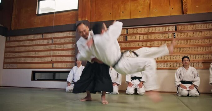 Master, students and martial arts in dojo for karate, kung fu and practice with fitness, people and battle. Fight, demonstration and sensei for training, class and self defense with exercise in Japan