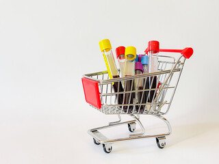 Some glasses vacutainer with blood analysis in a shopping basket. 