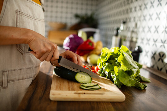 Man preparing fresh vegetables in kitchen
