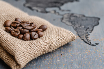 Coffee beans on a sack with a map of South America
