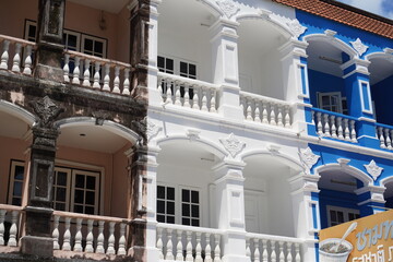Fototapeta premium Detailed view of windows, doors and balconies of city buildings 