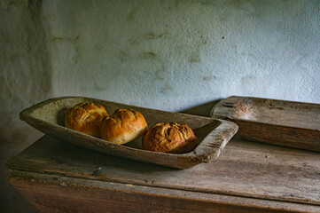 Rustic Bread Loaves in Vintage Wooden Trough Display
