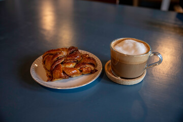 Delicious Cinnamon Pastry on White Plate With Cozy Lighting
