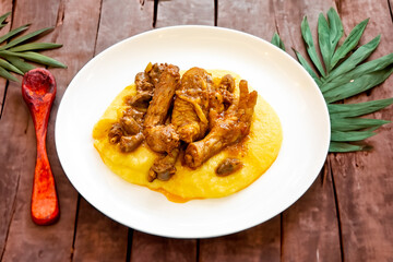 Traditional and rustic Brazilian dish, free-range chicken with polenta. Real food