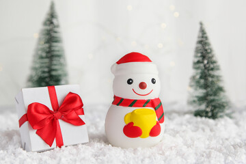 Snowman and Gift Box on Christmas and new year background