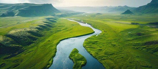 Fototapeta premium Serpentine River Winding Through Lush Icelandic Landscape