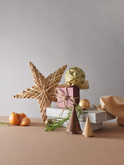 Creative still life with holiday decorations and gifts. Neutral background, copy space