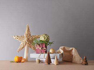 Creative still life with holiday decorations and gifts. Neutral background, copy space