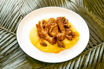 Traditional and rustic Brazilian dish, free-range chicken with polenta. Real food