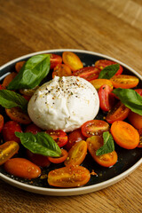 Burrata with cherry tomatoes and fresh basil