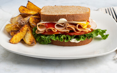  ham sandwich  served with potato wedges