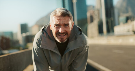 Mature man, fitness and portrait on bridge with break for tired, running challenge and marathon training. Breathe, exhausted and male athlete with cardio exercise or workout on city road with fatigue