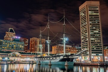 Fototapeta premium The USS Constellation at Night, Inner Harbor, Baltimore MD USA