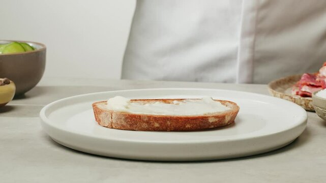 American pastrami sandwich in New York ham meet cuts. chef cooking Famous thick cut sous vide beef sandwich on restaurant cafe kitchen. Bread with curd cheese. Studio shot close up.