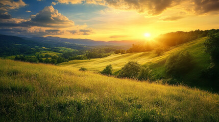 Fototapeta premium Golden sunset over rolling hills and a grassy valley.