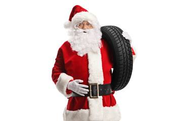 Santa claus carrying a car tire on his shoulder