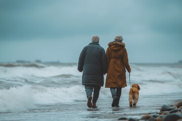 Senior Couple Walking Dog on Stormy Beach Retirement Coastal Life