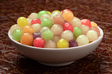 Bowl with colorful tasty cooked tapioca pearls close up