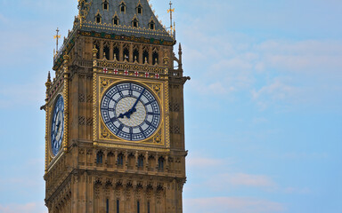 Big Ben tower clockface on Great Clock of Westminster parliament houses, closeup detail to gothic...