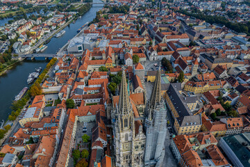 Obraz premium Beautiful aerial view of Regenesburg, its massive gothic St Peter cathedral, the Danube river and the Old Stone Bridge
