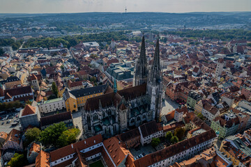 Obraz premium Beautiful aerial view of Regenesburg, its massive gothic St Peter cathedral, the Danube river and the Old Stone Bridge