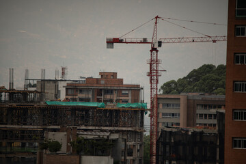 building under construction with crane