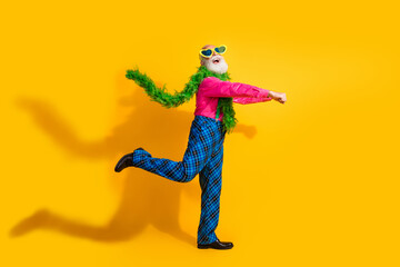 Full length photo of nice senior male excited dancing boa wear pink shirt plaid pants suspenders fancy outfit isolated on yellow background