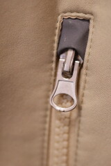 A close-up view of a zipper on a bag, useful for e-commerce or travel images.