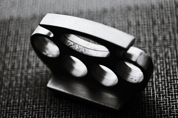 Black and white image of metal knuckledusters.
